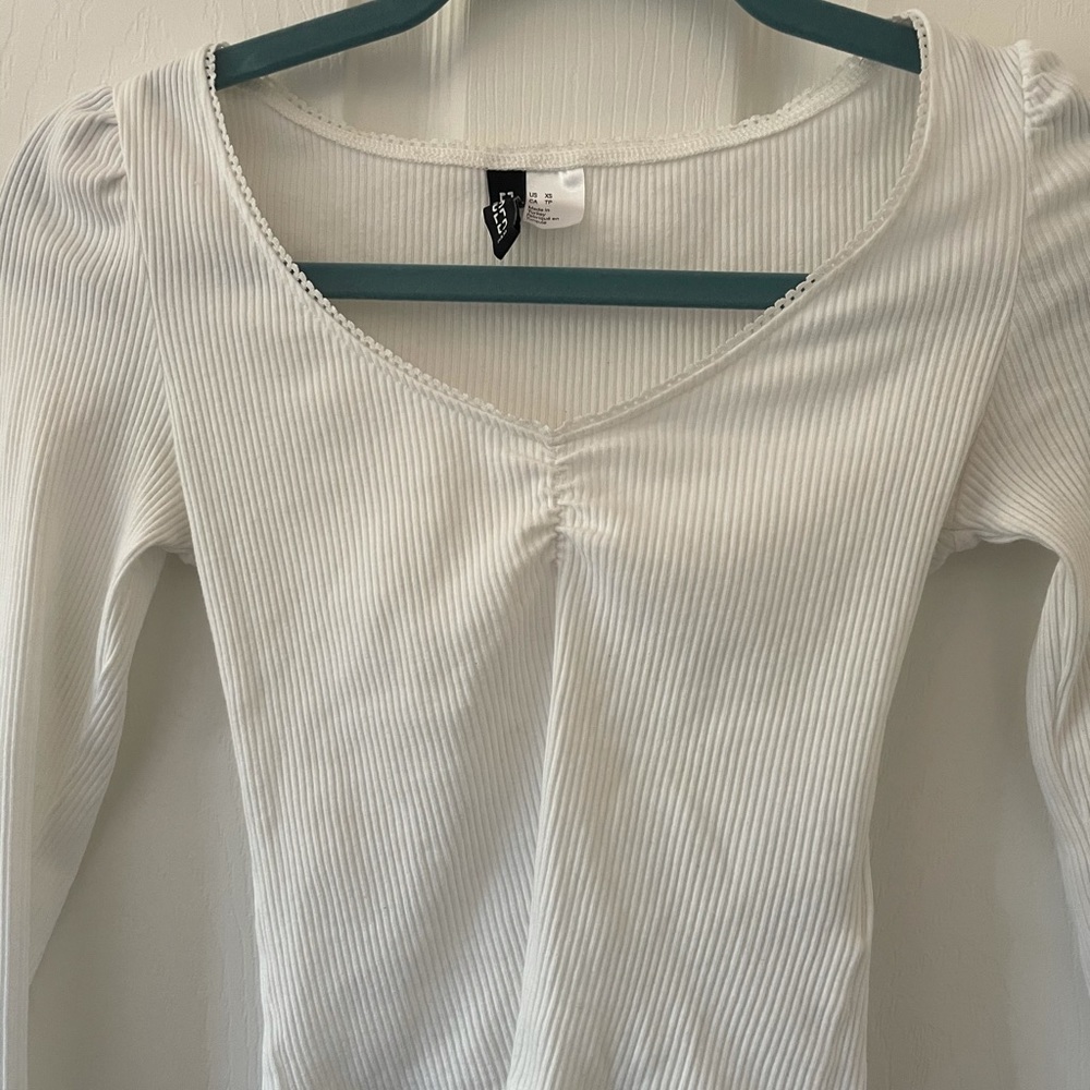 Selling a cute white long sleeve top.